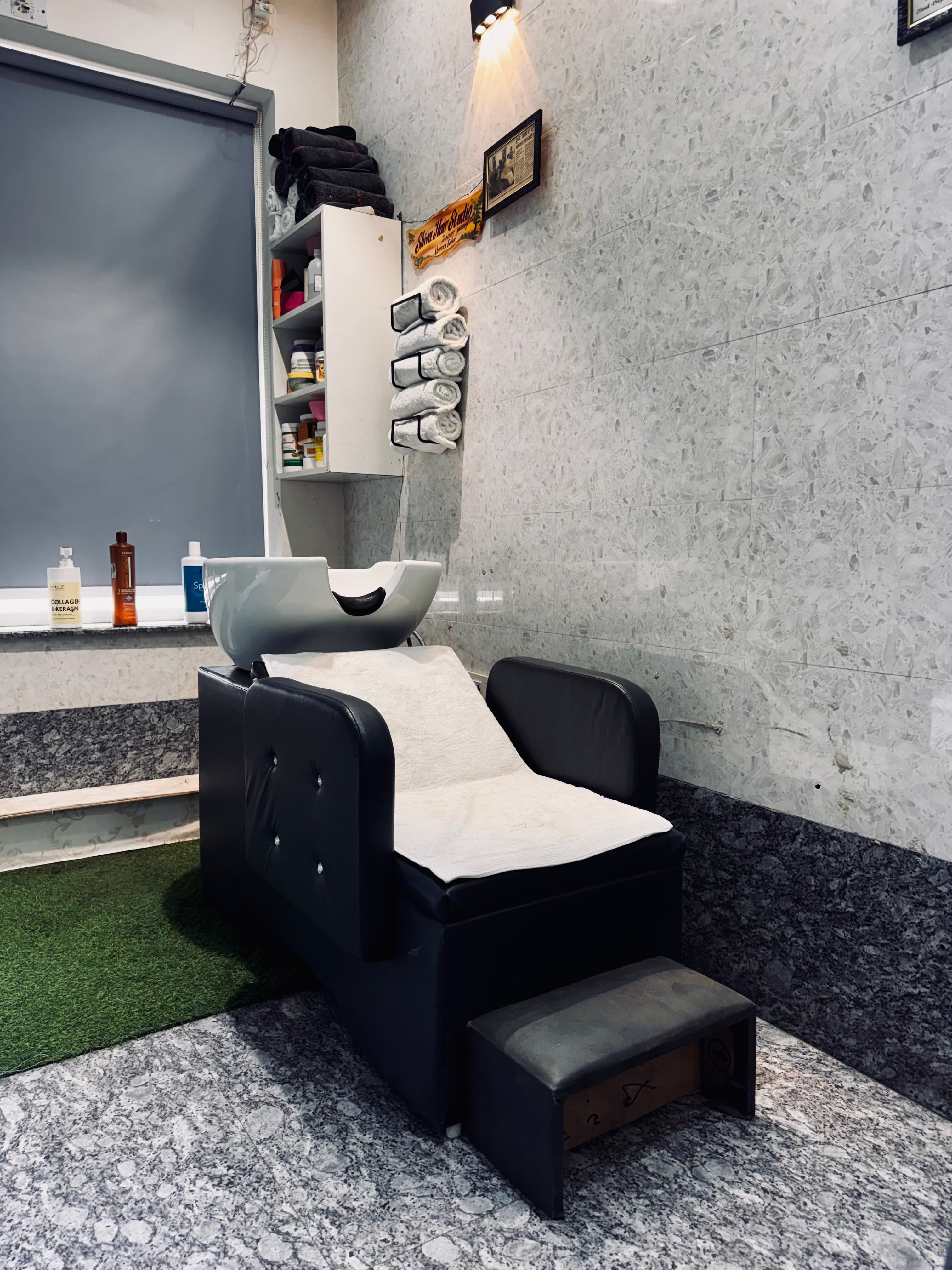 Wash station and salon chair at Shiva Hair Studio.