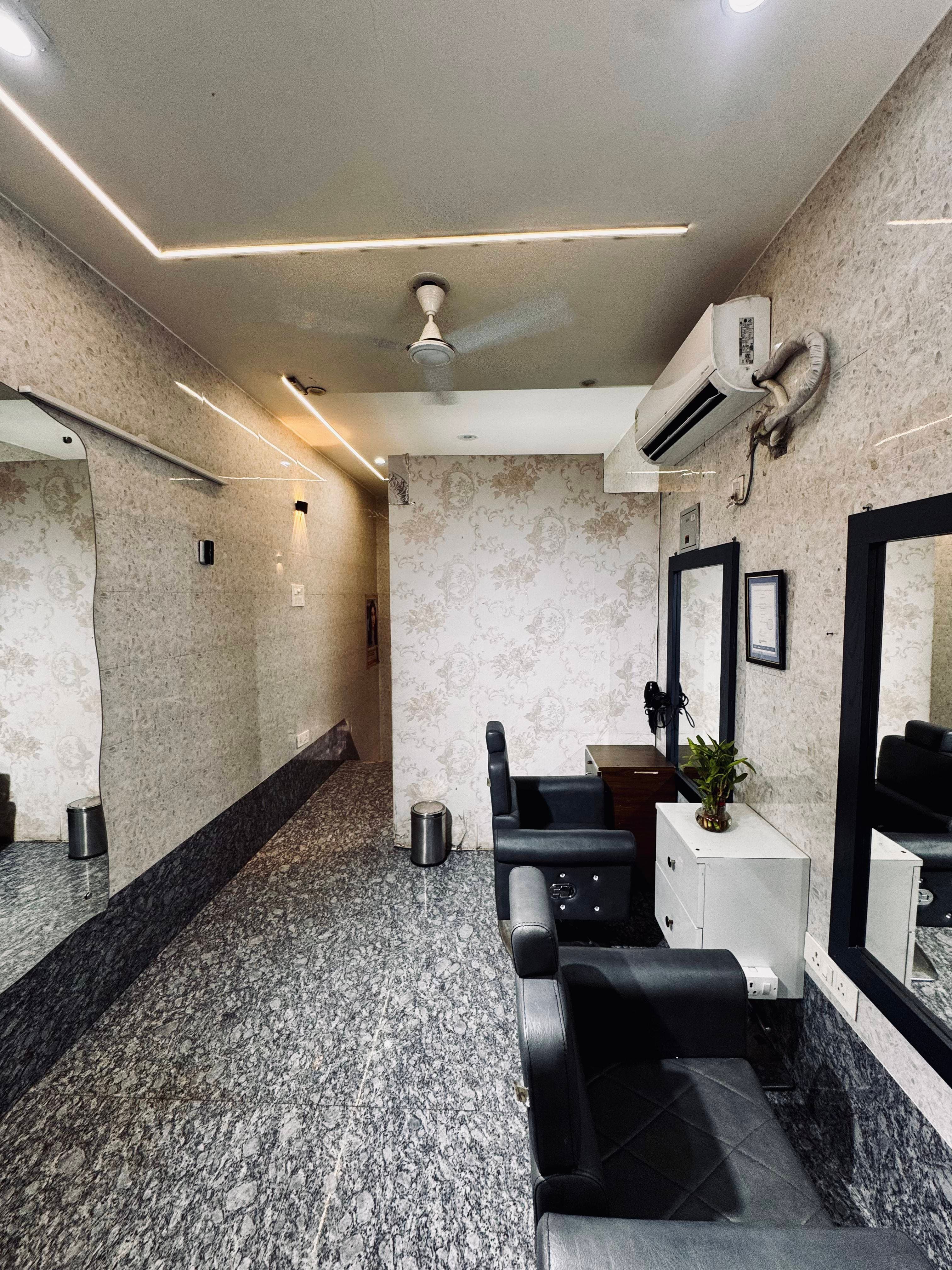 Salon chairs and mirrors inside Shiva Hair Studio.