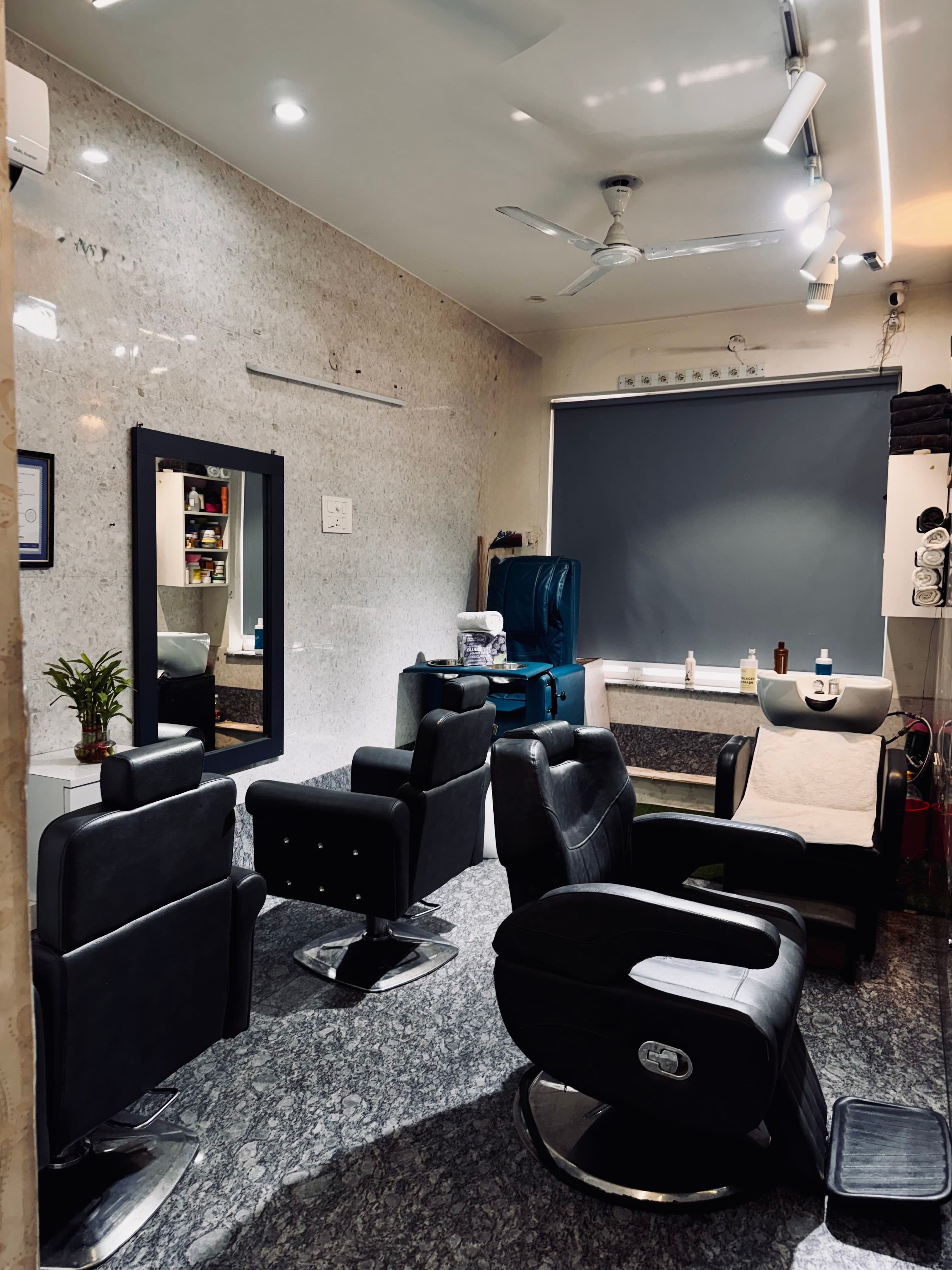Salon chairs and wash station inside Shiva Hair Studio.